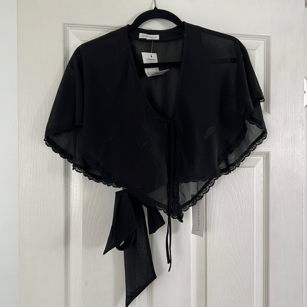 Floaty sheer black top with lace trim and halter tie back under
